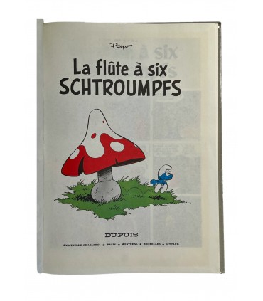 La Flûte à six Schtroumpfs. Édition en couleurs - 1974. Dessin accompagné d'un envoi autographe.